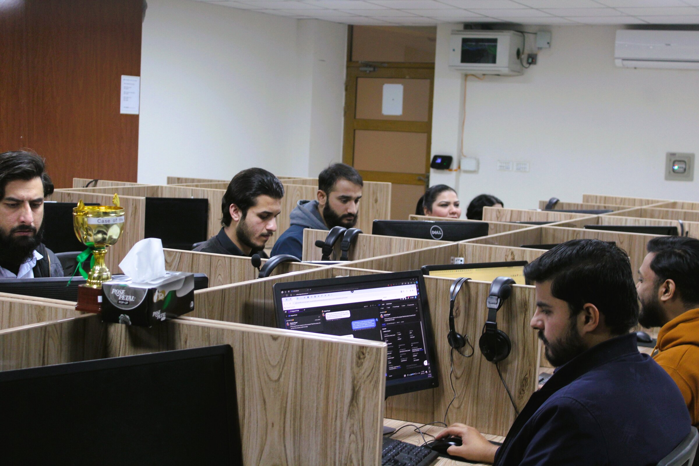 Agents at their desks on the production floor